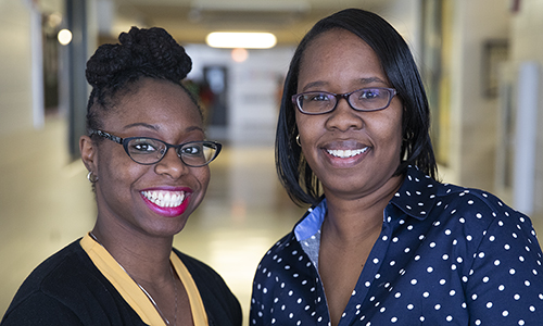 Two teachers smiling