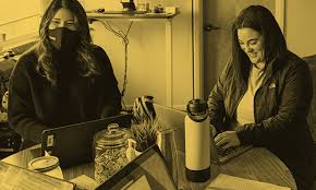 Teachers at desk.